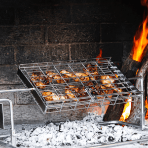 rotisserie chicken in the standard flat basket on the fire
